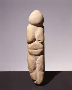 Venus of Chiozza stone figurine with a stylized standing female form and prominent breasts