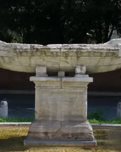 Fontana della Navicella stone boat sculpture on a pedestal in a fountain basin