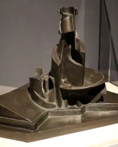 Development of a Bottle in Space, a dark bronze abstract sculpture with geometric and curving forms on a tiered base.