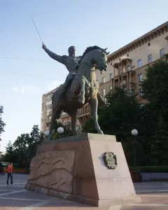 Pyotr Bagration Monument, an equestrian statue on a tall granite pedestal in a city square.