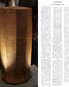 The Rassam cylinder, a tall reddish-brown inscribed prism covered in dense horizontal text lines.
