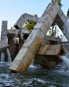 Vaillancourt Fountain with large concrete blocks and tubes sending water into a turbulent pool.