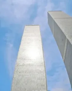 Cloud Fortress in the foreground with the Twin Towers rising behind it against a blue sky.