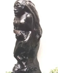 Oviri sculpture by Paul Gauguin, a dark standing figure with long flowing hair and an animal form at the base.