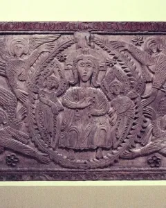 Relief panel from the Rachis Altar showing a seated central figure, two smaller figures, and surrounding winged haloed beings.