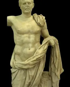 General of Tivoli marble statue of a draped male figure beside a small support, shown against a black background.