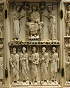 Harbaville Triptych with three carved ivory panels showing a central seated figure flanked by standing figures, busts in roundels, and inscriptions.