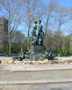 Bailey Fountain sculpture in a circular stone basin in a Brooklyn plaza
