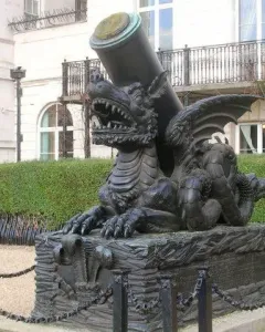 Cádiz Memorial sculpture of a winged dragon-like creature supporting a cannon barrel