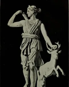 Diana of Versailles, a classical statue of a draped female figure reaching for an arrow with a small deer beside her.