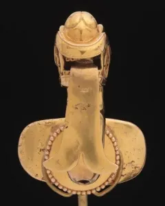 Serpent labret with articulated tongue shown from above on a black background.