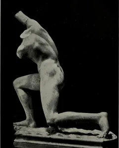 Incomplete Subiaco Ephebe sculpture of a kneeling male figure with broken arms on a rectangular base.