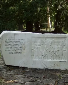 Keys Handover Memorial stone block with Cyrillic inscription and relief of figures exchanging keys