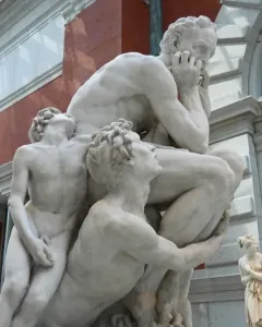 Ugolino and His Sons marble sculpture showing a distressed seated man with two emaciated sons pleading around him