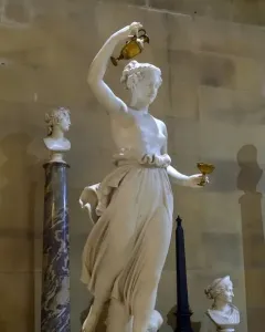 Hebe, a white marble statue of a female figure holding a golden ewer and goblet
