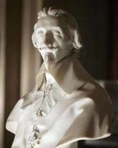 Marble bust of Cardinal Richelieu with wavy hair, mustache, and pointed goatee.