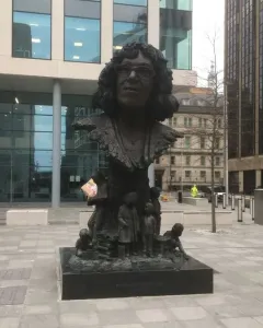 Betty Campbell statue in Cardiff, a bronze monument with a bust of a woman above children reading around the base.
