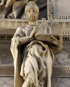 Saint Petronius stone statue in robes and a mitre, holding a miniature walled city.