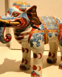 Kakiemon elephant porcelain figurine with blue and red floral patterns