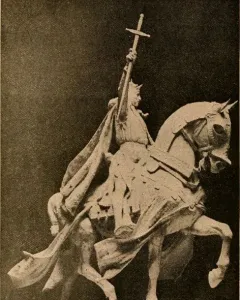 Apotheosis of St. Louis, a bronze equestrian statue of a crowned figure on a rearing horse against a blue sky