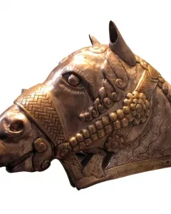 Sassanian horse head sculpture with ornate metal detailing, shown in profile facing left.