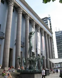 Orpheus Fountain in front of Stockholm Concert Hall, with a bronze figure playing an instrument and smaller statues around the basin.
