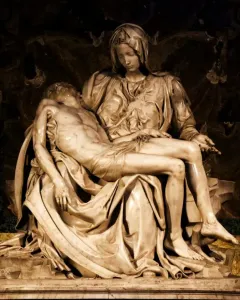 Pietà marble sculpture of Mary cradling the body of Jesus across her lap