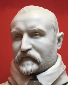 White marble bust of Carlo Antonio del Pozzo with a mustache and goatee against a red background.