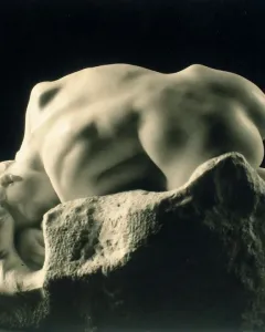 Rodin’s Danaid, a marble nude female figure bent over a rough stone base with her head resting against it.