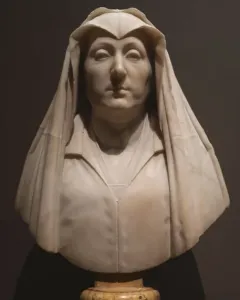 Marble bust of Camilla Barbadori with a veiled head and shoulders on a marble pedestal.