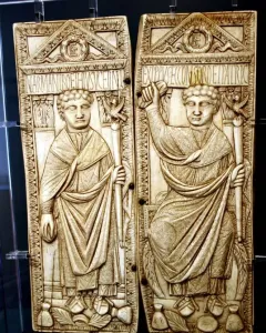 Diptych of Boethius with two carved ivory panels showing robed male figures holding staffs.