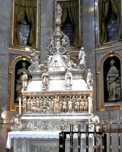 Arca di San Domenico, a richly carved marble monument with figures and reliefs inside a church interior