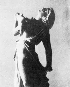 Dancing Maenad statue in a dramatic twisting pose with arms raised and head thrown back.