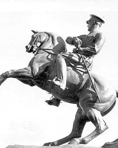 Statue of Honor, an equestrian sculpture of a man in military uniform holding a sword on a rearing horse.