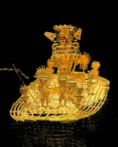 Muisca Raft with stylized gold figures on a raft-shaped base, featuring a larger figure with an elaborate headdress at the back.