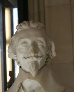 Marble bust of Cardinal Richelieu with wavy hair, mustache, and pointed goatee.