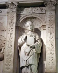 Saint Gregory marble statue in an ornate arched niche, holding a large book and wearing a papal tiara.