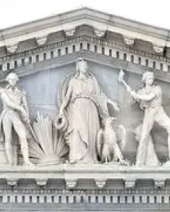 Apotheosis of Democracy pediment with a central standing figure and flanking sculpted groups on the U.S. Capitol