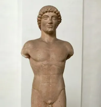Apollo Strangford, a standing nude male statue with short curly hair and missing arms.