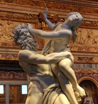 The Rape of Proserpina marble sculpture showing a bearded man lifting a smaller female figure in a dramatic pose.