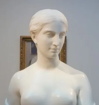 California, a white marble bust of a woman with short hair and bare shoulders on a pedestal