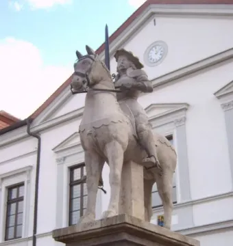 Haldensleben Roland equestrian statue with a knight holding a raised sword on a stone pedestal.