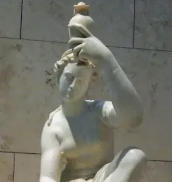 Seated marble female figure lifting one foot and holding a small vessel above her head.