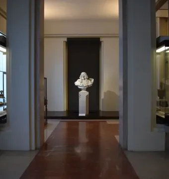 Bust of Francesco I d\'Este on a pedestal at the end of a museum hall.