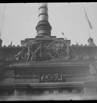 Soldiers\' and Sailors\' Monument artillery frieze with soldiers operating a cannon beneath a fluted column