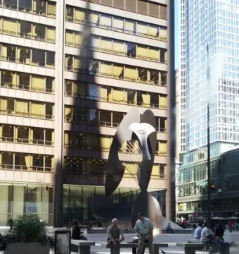 The Picasso, a towering abstract steel sculpture, stands in an urban plaza with benches and people nearby.