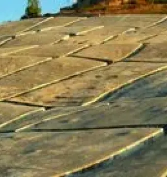 Il Grande Cretto stretching across a hillside in a pattern of light concrete blocks and dark fissures.