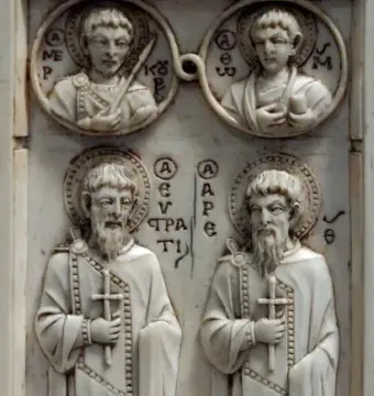 Harbaville Triptych ivory relief with four haloed figures, including two standing saints below and two roundels above.