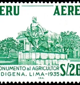 La yunta monument showing a seated man on a large horned bovine beside another bovine on a tiered pedestal.