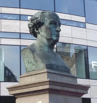 The Schadow Monument, a weathered bronze bust of W. v. Schadow on a tiered stone pedestal.